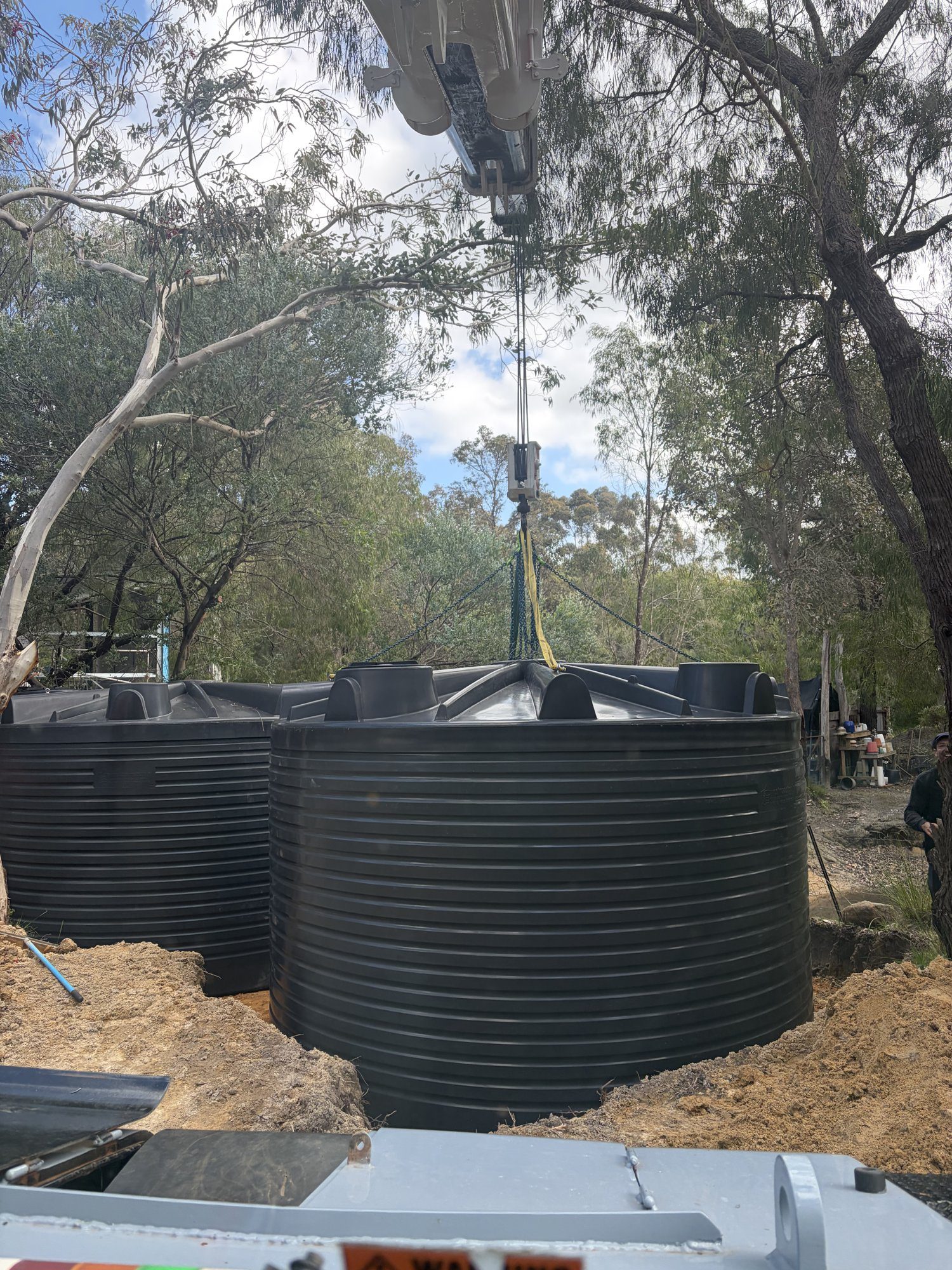 westside-rigging-franna-crane-rainwater-tank-busselton-2 Rainwater tank on the hook being lowered into place, Busselton