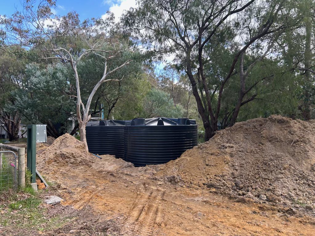 westside-rigging-franna-crane-rainwater-tank-busselton-3 Two rainwater tanks in final position ready for backfill, Busselton