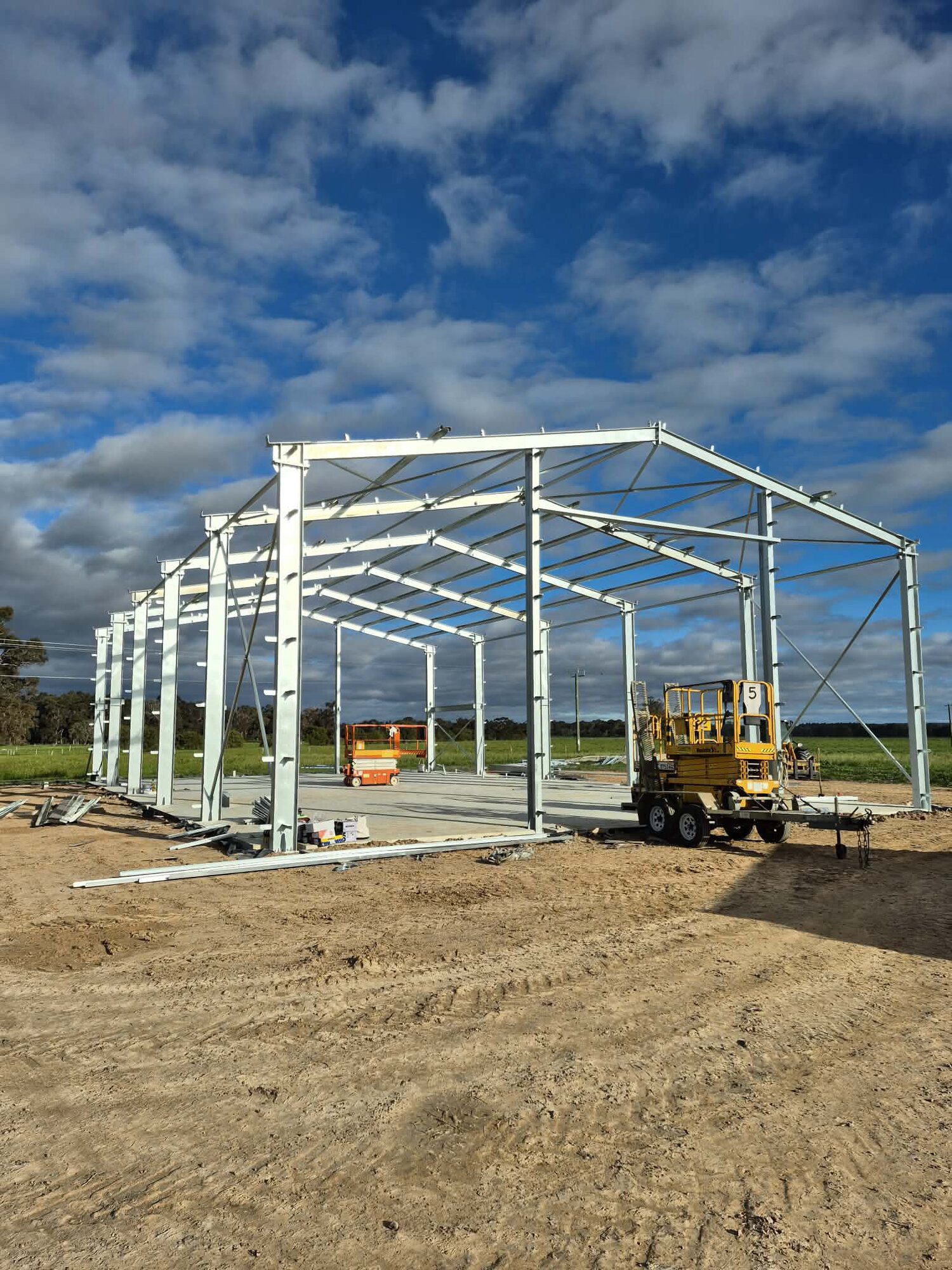 westside-rigging-franna-crane-shed-erection-vasse-1 Steel shed frame standing on site, Vasse